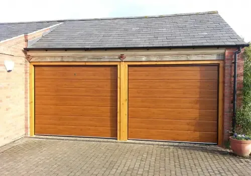 Cover for Discover Automatic Sectional M-Rib Garage Doors in Grantham in Golden Oak Finish