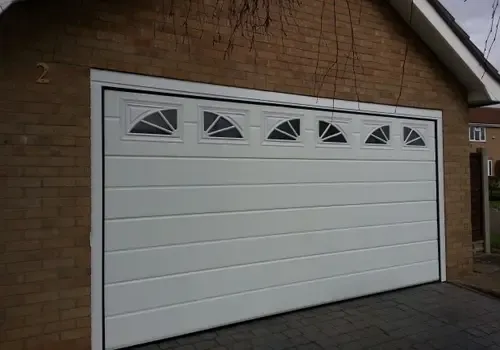Cover for GDS Sectional Ribbed Garage Doors with windows in Grantham 