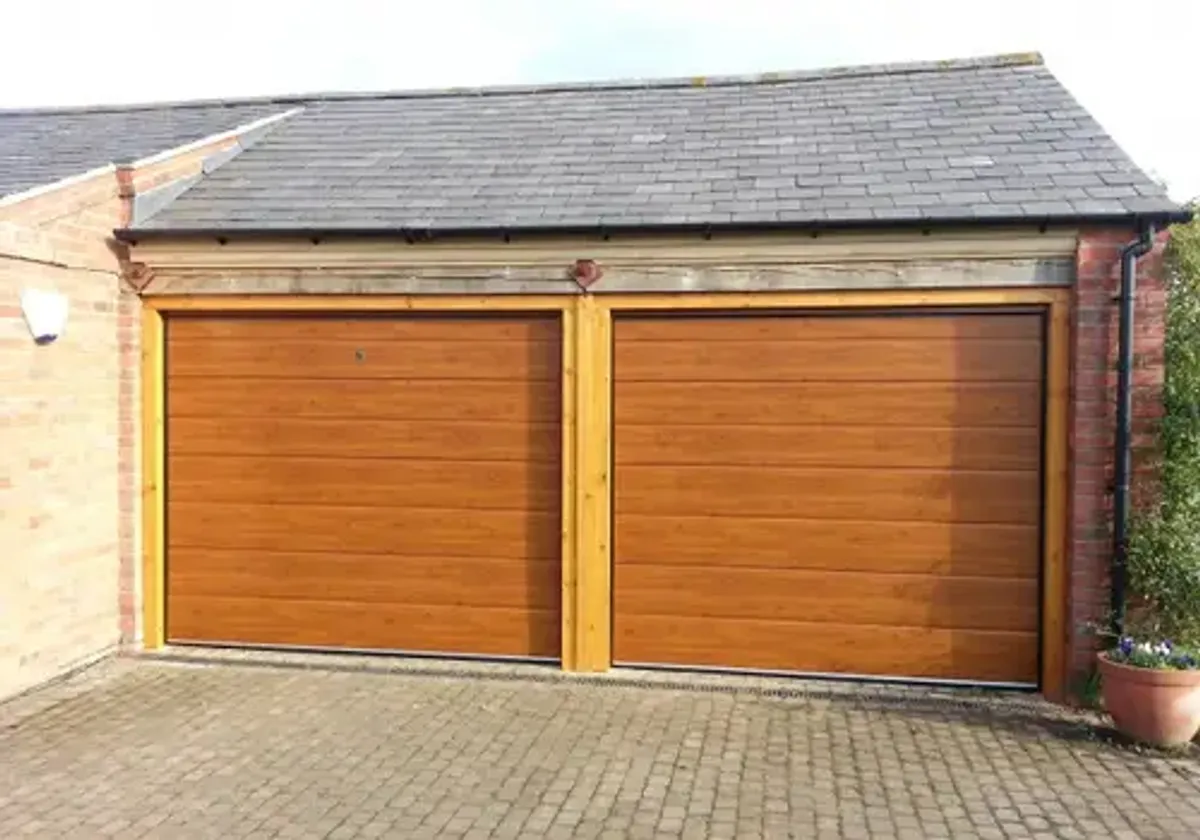 Cover for Discover Automatic Sectional M-Rib Garage Doors in Grantham in Golden Oak Finish