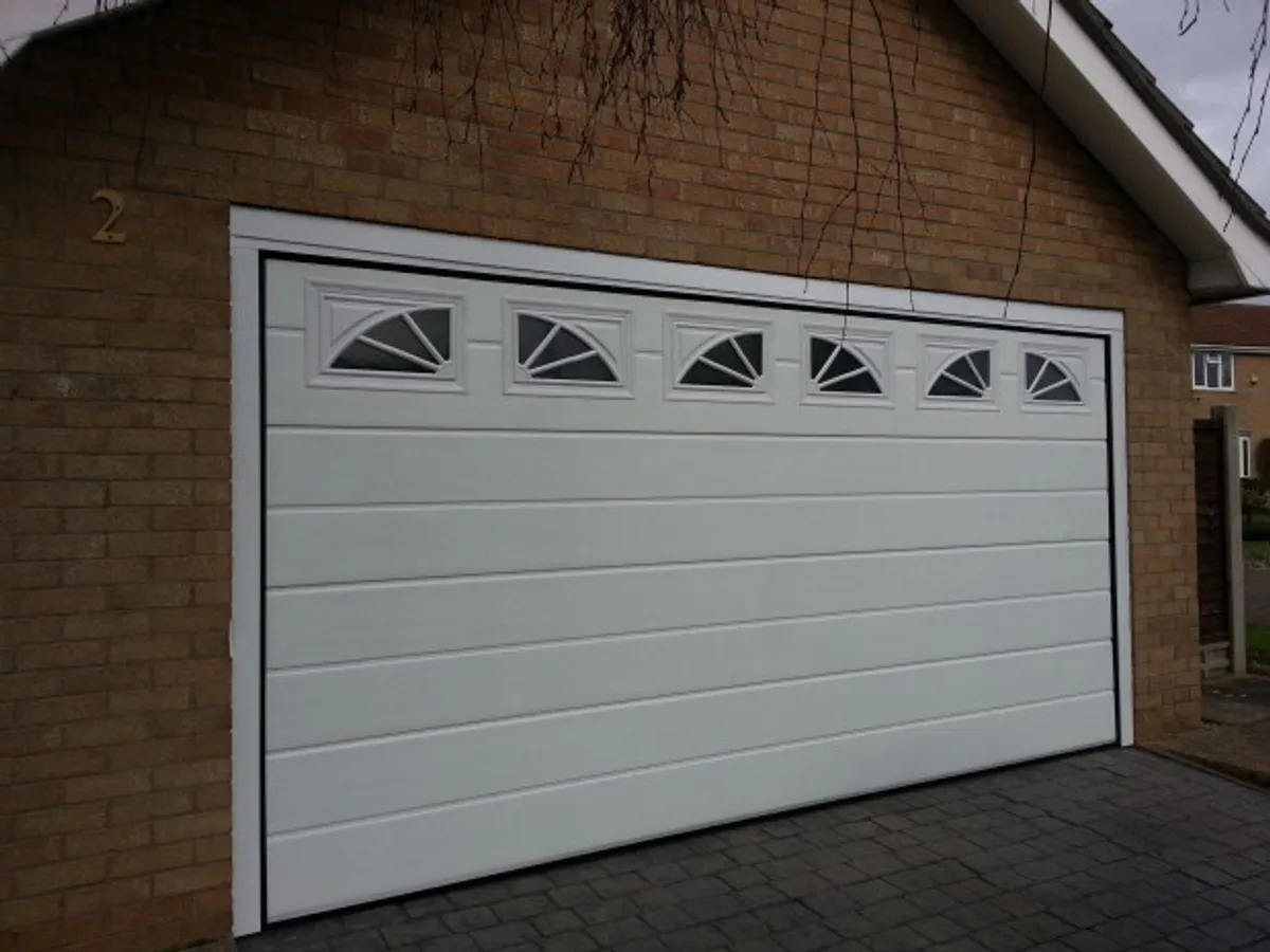 Cover for GDS Sectional Ribbed Garage Doors with windows in Grantham 