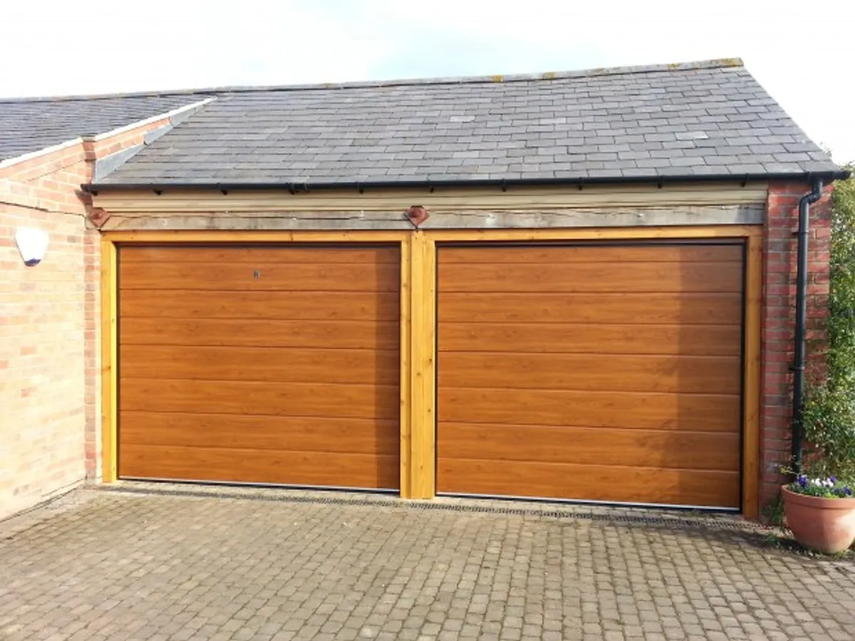 Cover for Discover Automatic Sectional M-Rib Garage Doors in Grantham in Golden Oak Finish