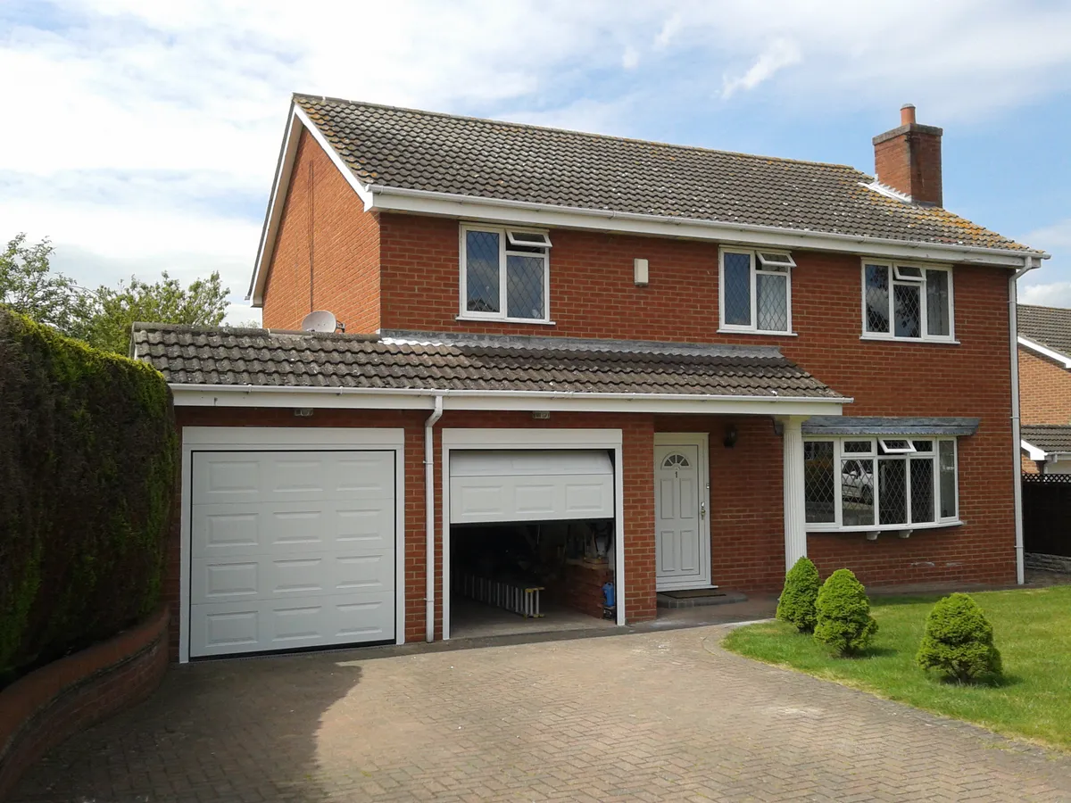 Cover for The Perfect Fit - Twin Sectional Garage Doors in Southwell