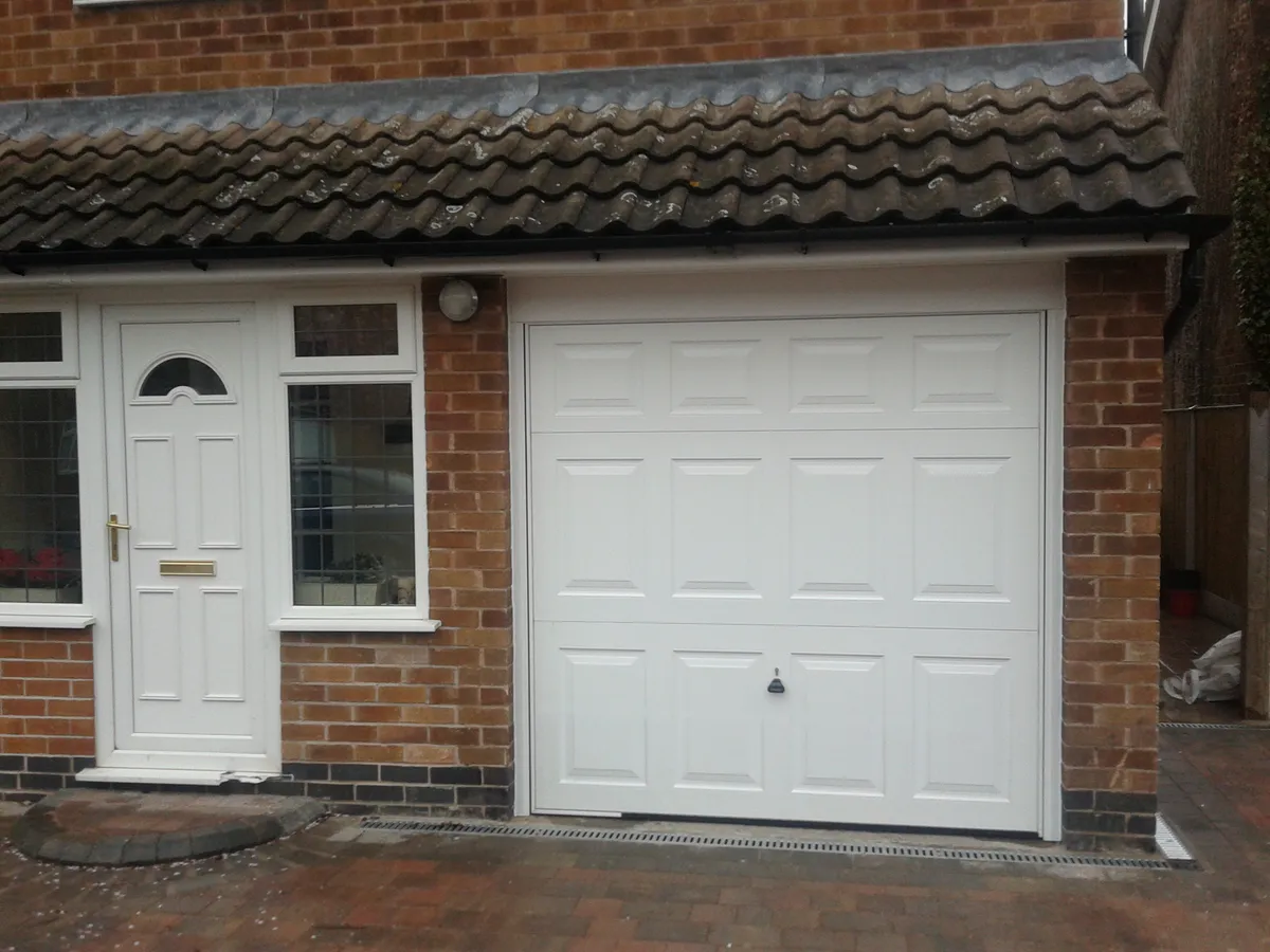 Cover for White Canopy Garage Door Installation in Nottingham - Professional and Reliable Service
